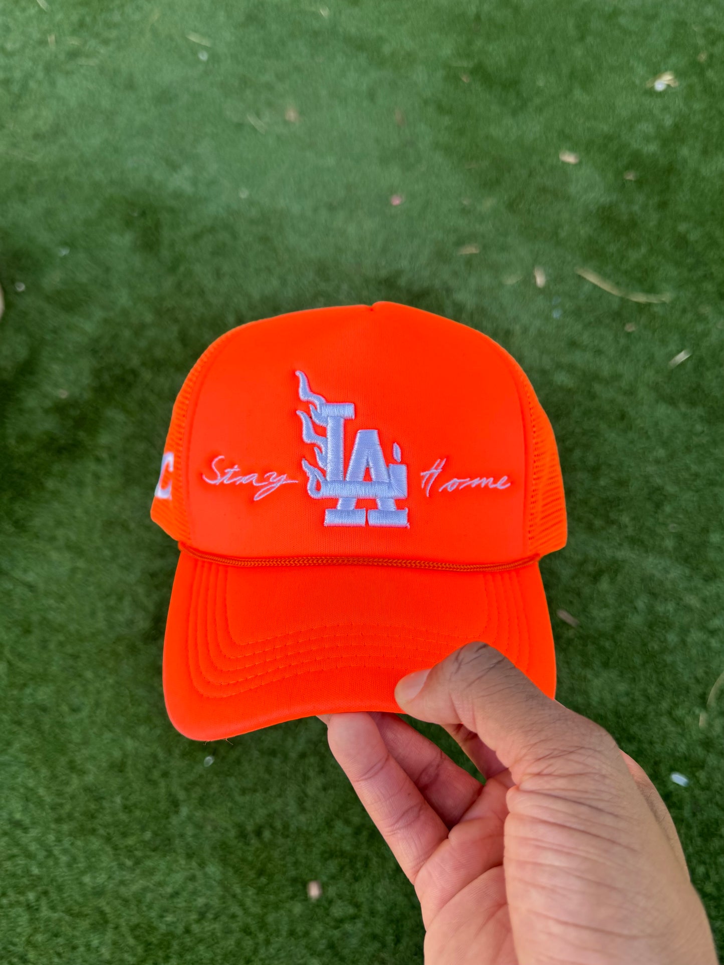 Orange “Stay Home” trucker